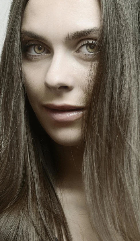 a woman with long hair with a face of grey hair
