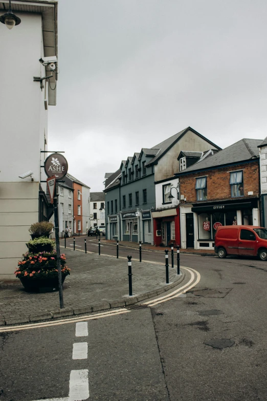 a town street lined with houses on the side of a road