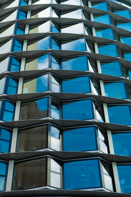 the reflection of a building's windows in another window