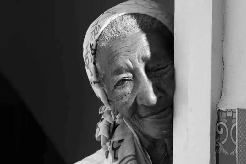 black and white pograph of an elderly woman smiling