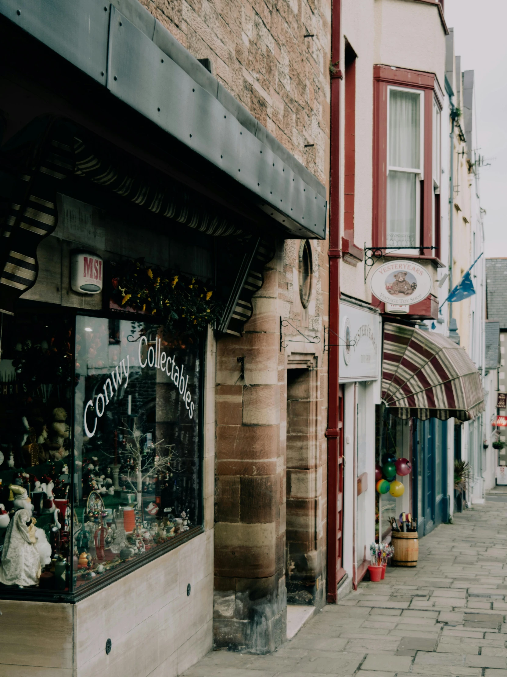 a street scene with focus on the store windows