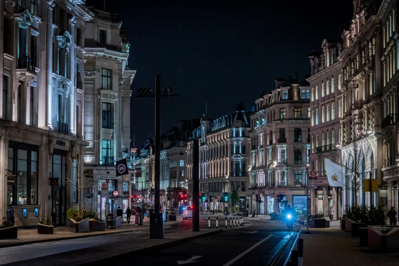 night scene with building on street and illuminated street signs