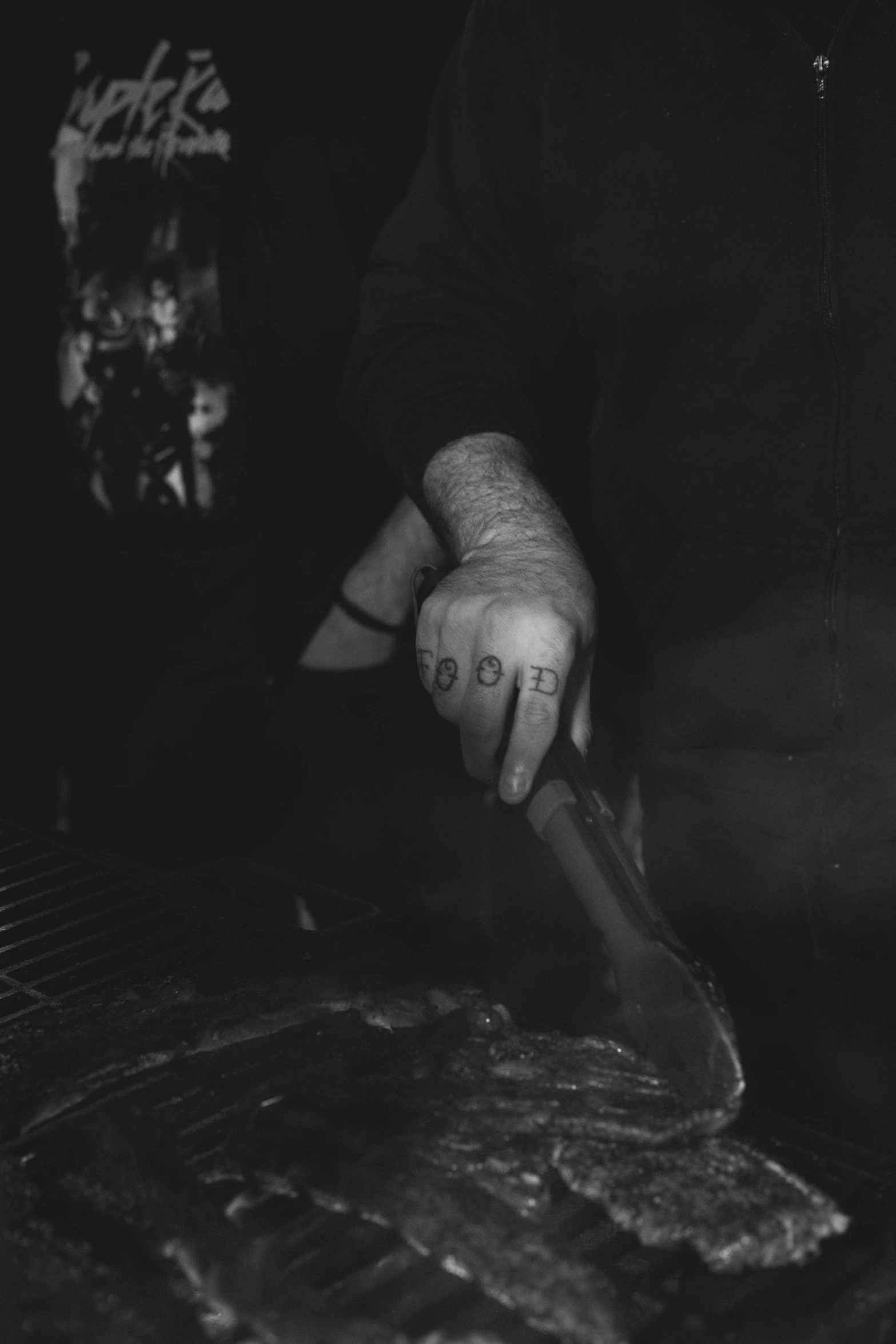 a person slicing meat into small pieces