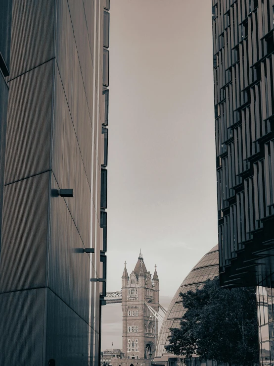 a view of some tall buildings and a cloudy sky