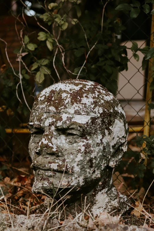 a statue with lots of dirt on it