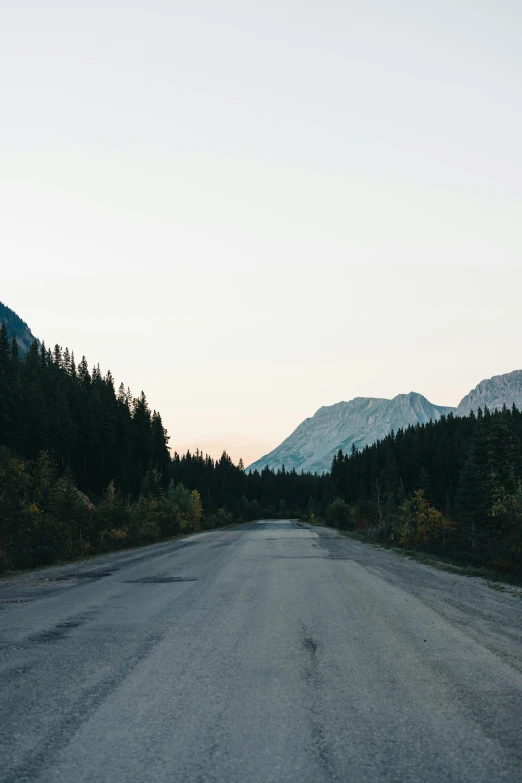 the view from the side of an empty road looking into the distance