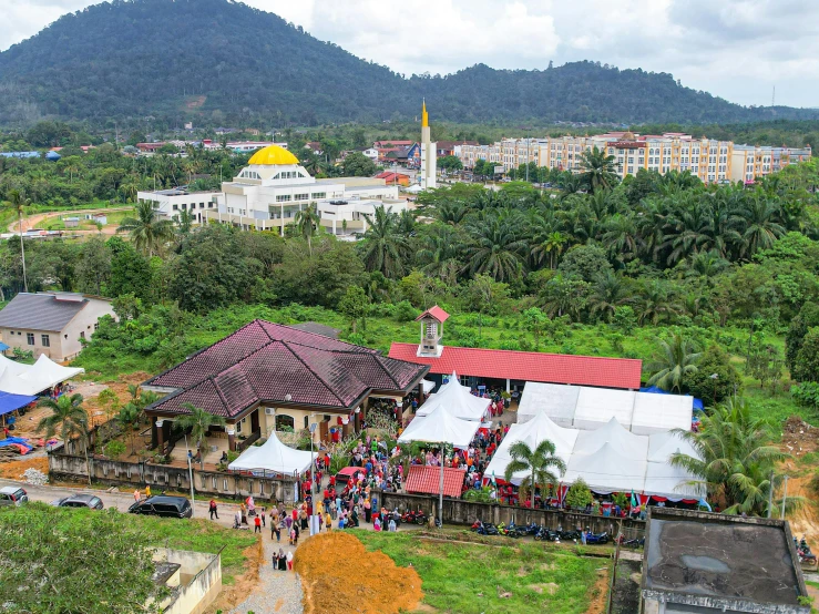 a village surrounded by trees and other buildings