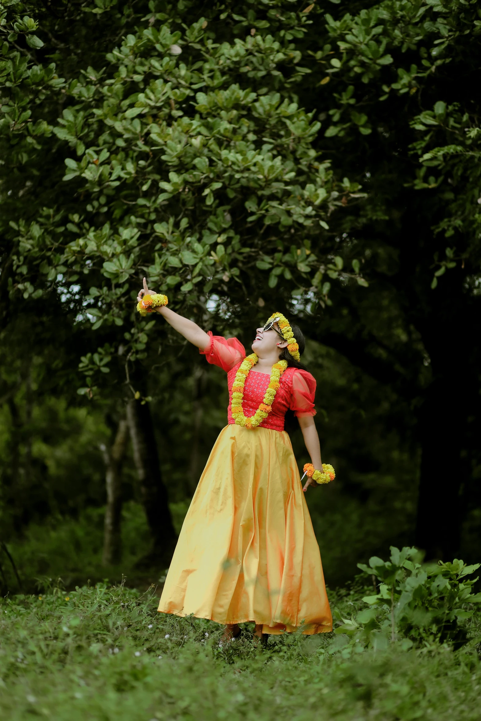 a woman in yellow and red wearing a colorful costume