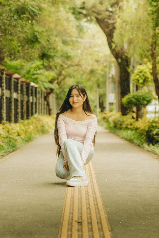 woman sitting on the curb waiting for train