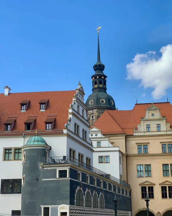 buildings with a steeple at the top in a city