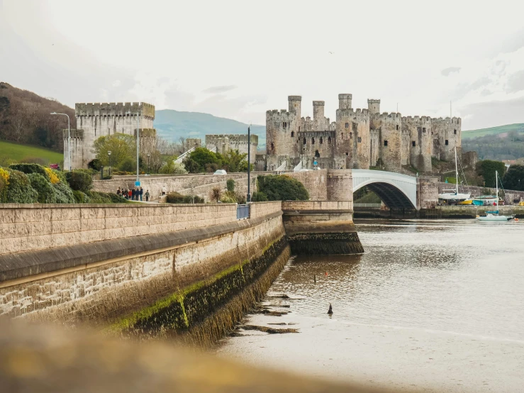 a castle with people walking up the side of it