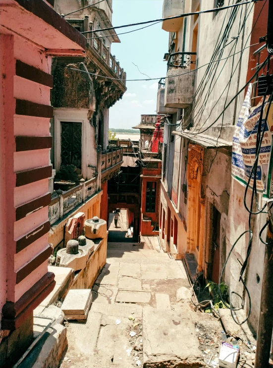 the back streets of two buildings are lined with wooden slats