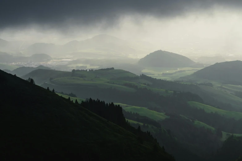 an image of a mountain valley on a foggy day