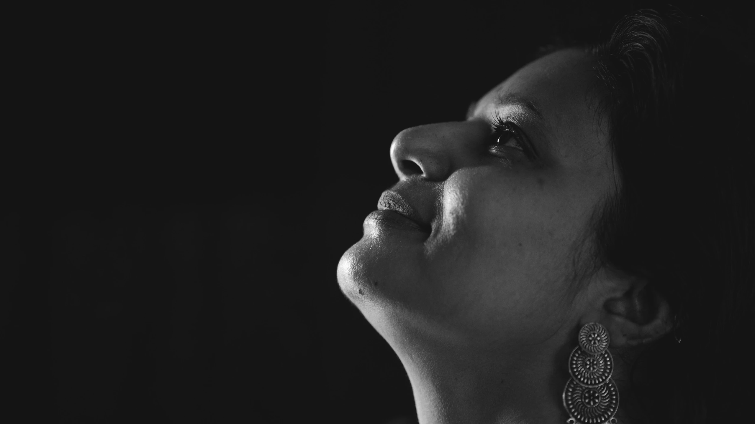 black and white image of a woman's face