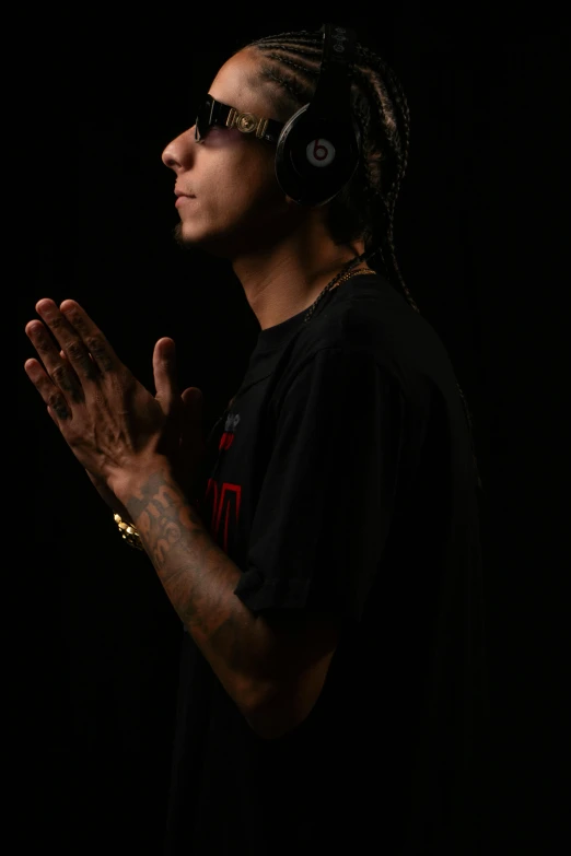 a person wearing headphones on a black background