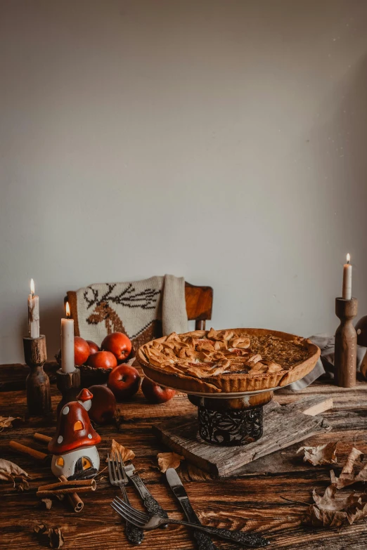 a rustic display of apples and other utensils