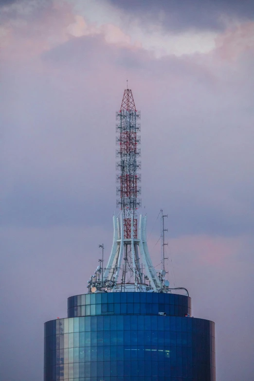 the blue structure is covered with wires and pipes