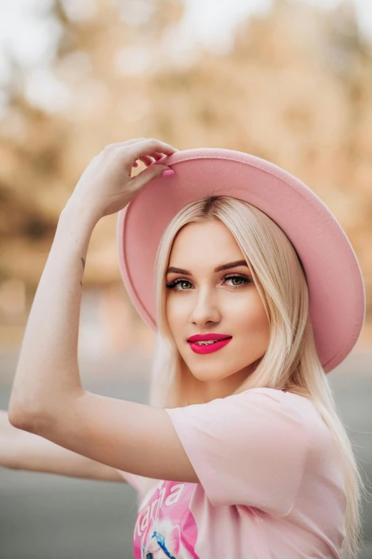 a girl with pink lips wearing a pink hat