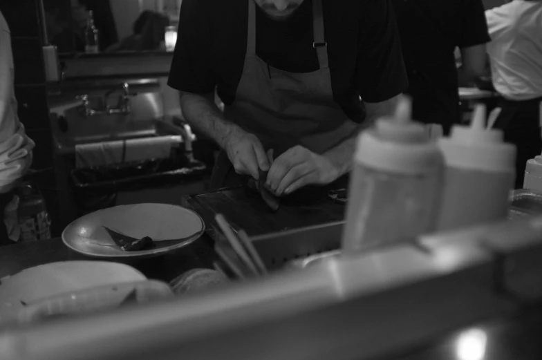 an old fashioned cook preparing food on a  board