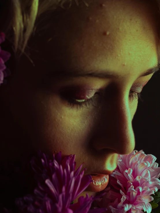 a close up po of a girl with flowers