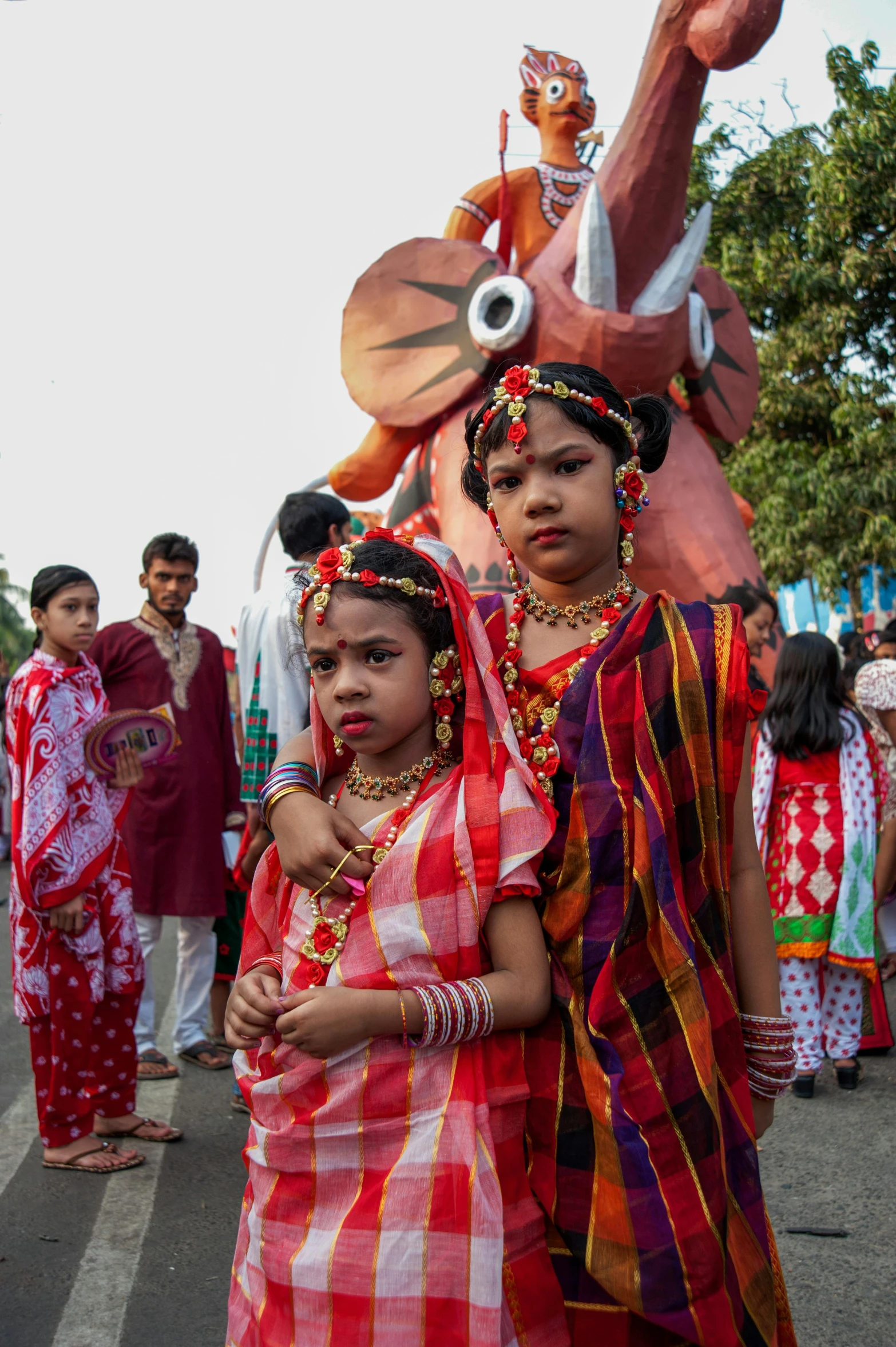 two women standing near each other in costumes