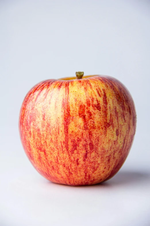 an apple sitting on the floor with a lot of coloring