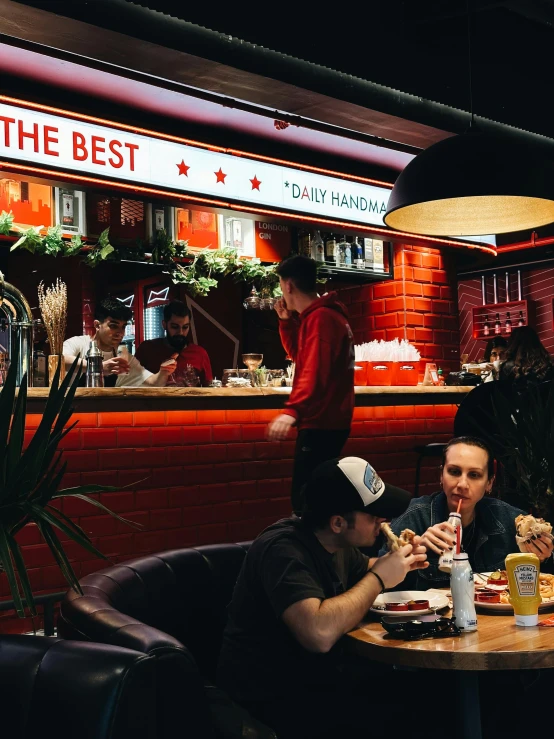 people in a busy restaurant eating and drinking