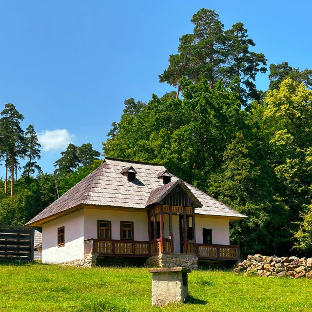 a building with a brown roof in the middle of the day