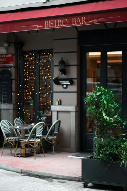 an outdoor cafe with a bunch of tables and chairs