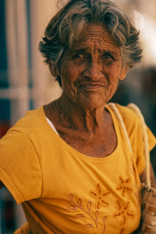 a close up of an older person wearing a shirt