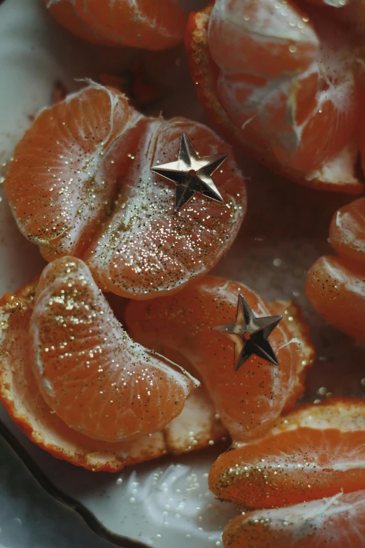 an orange covered in salt and stars sits on top