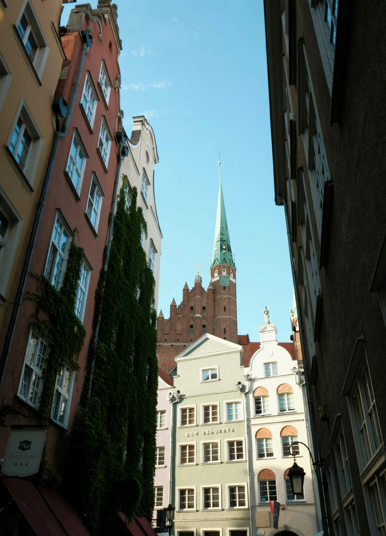 a steeple in the sky above some buildings