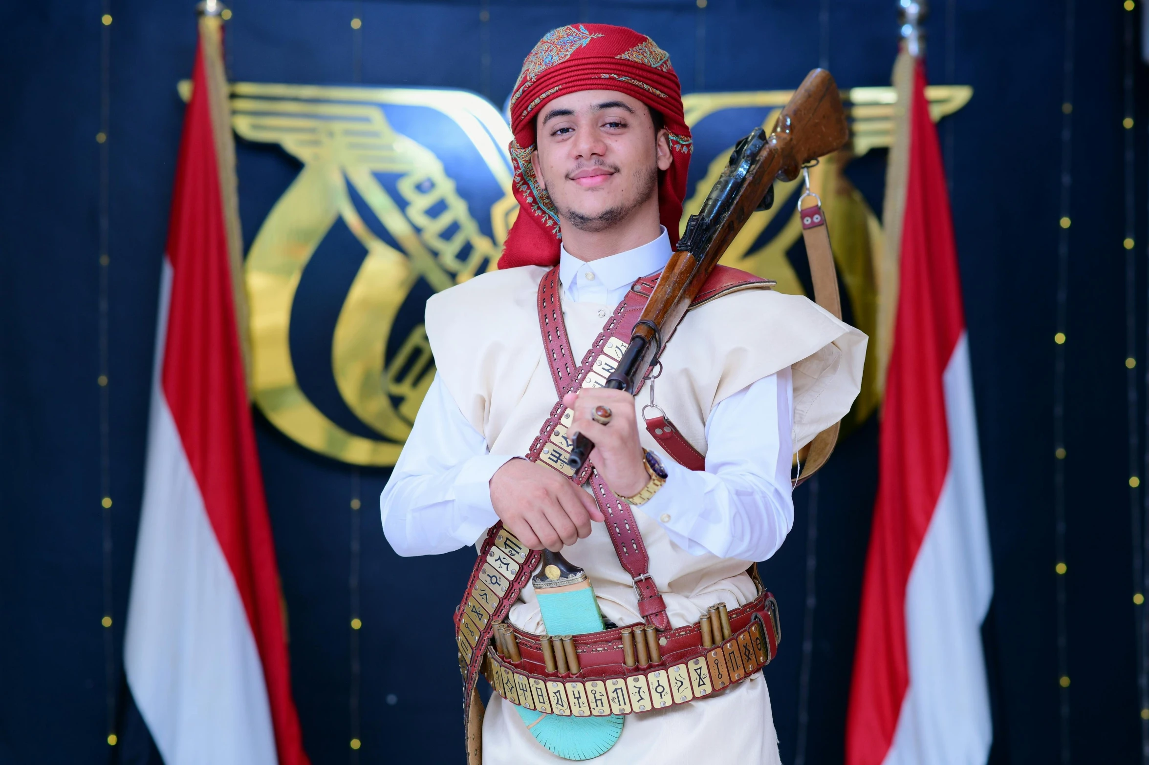 a man dressed in a traditional costume holding an akm rifle