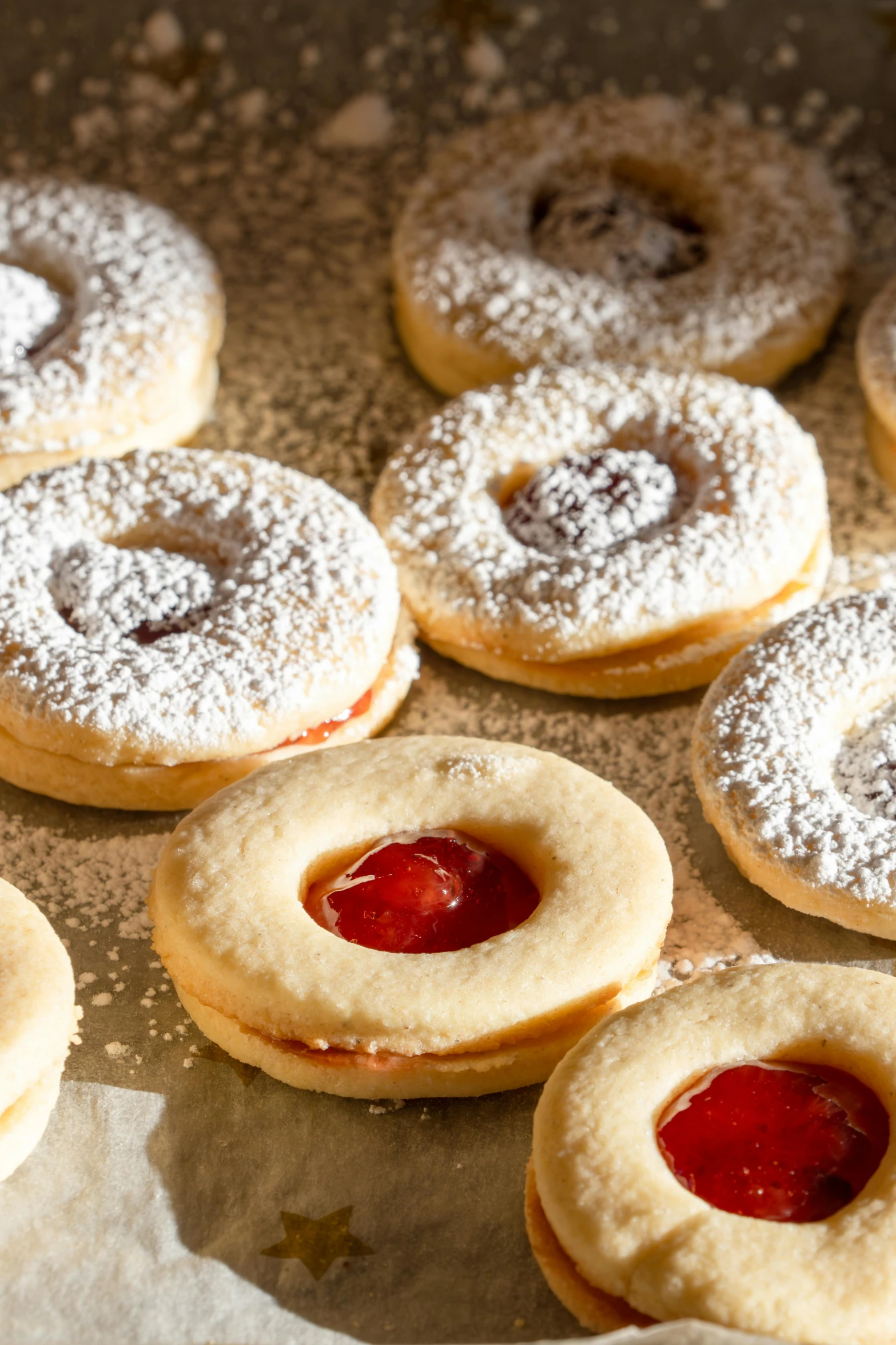 the cookies have strawberry jam on top of it