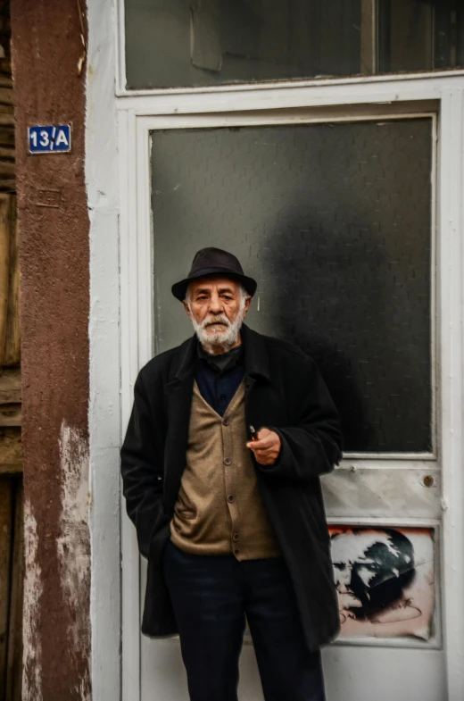 a man that is standing up by a door