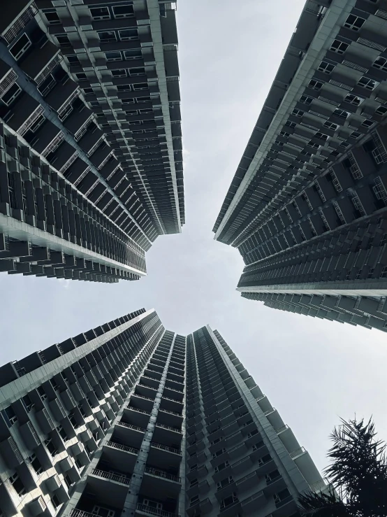 view looking up into the buildings of an urban building