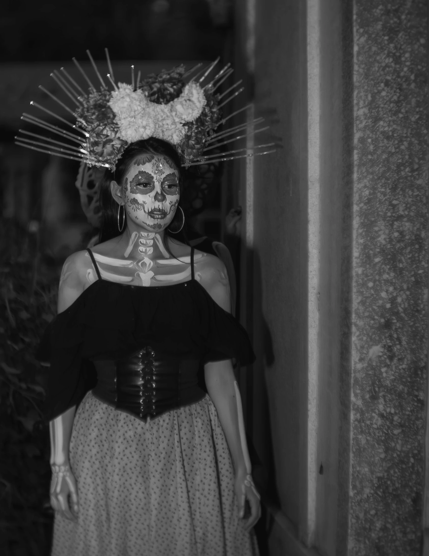 woman with face makeup wearing skull decoration