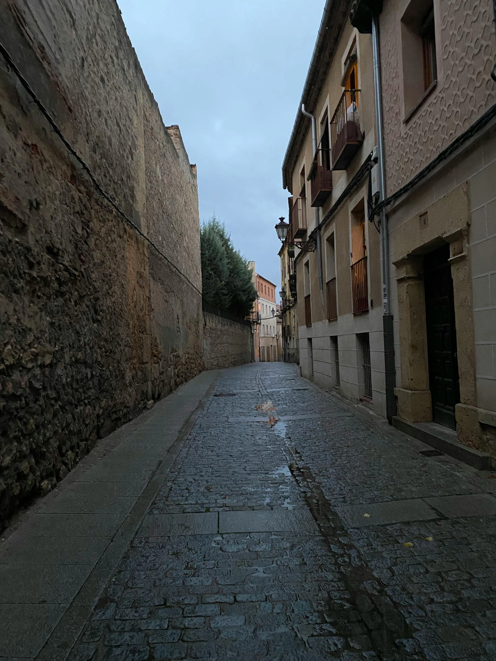 two rows of brick buildings near an alley way