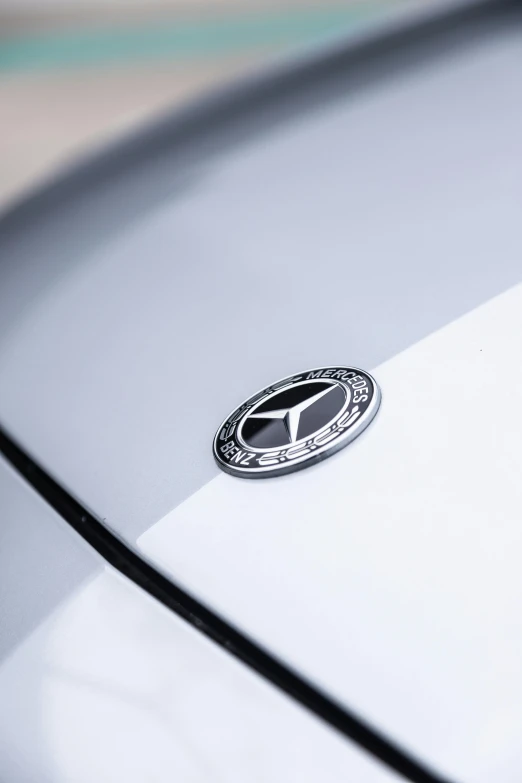 a small badge on a car in a white car