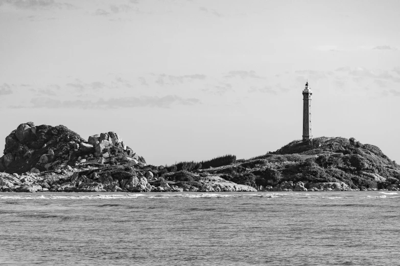 an island off the coast is shown in black and white