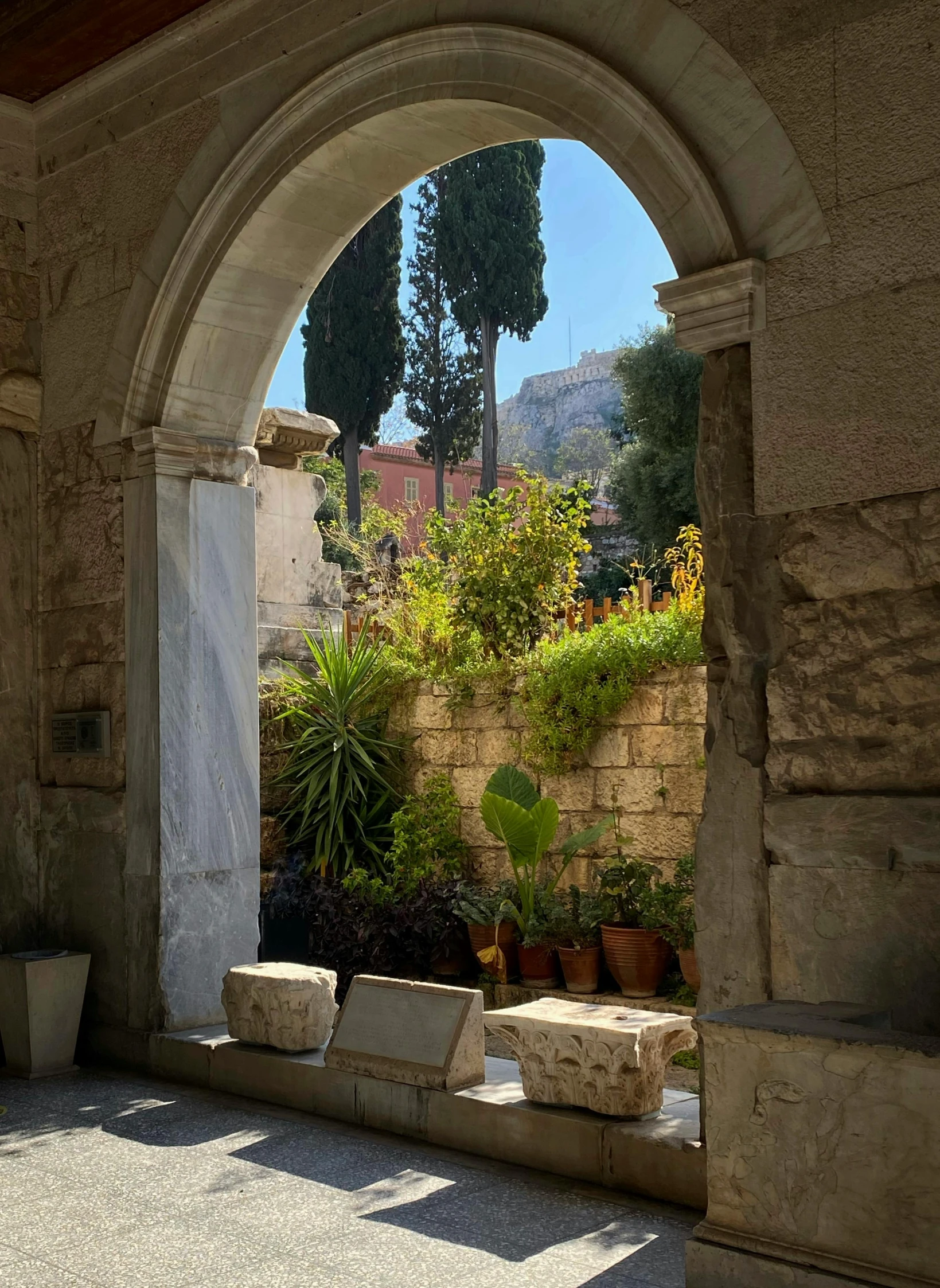 an arch sits open to a garden area