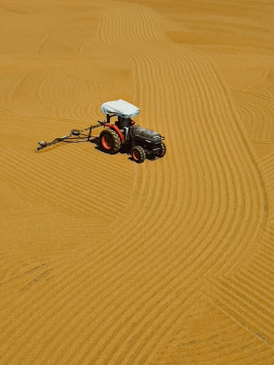 a tractor parked in the middle of the desert