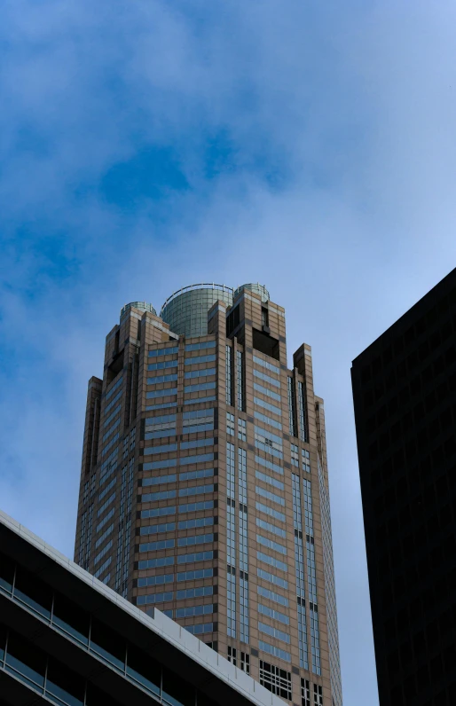 there is a tall, triangular, brick building in the background