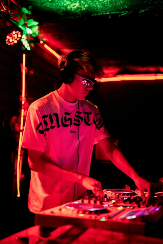 a dj spins up music at his turntable