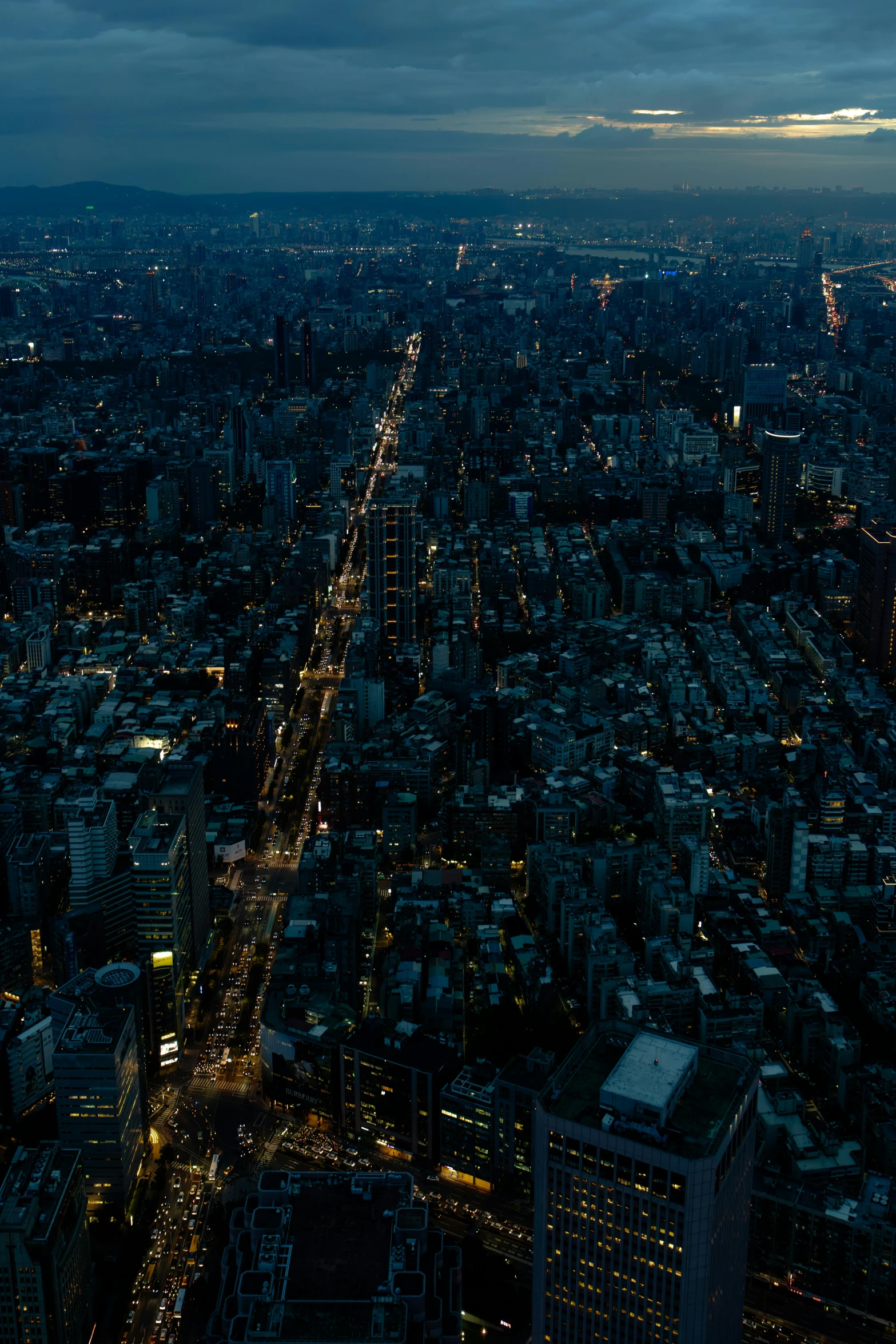 a night view of the city lights and buildings