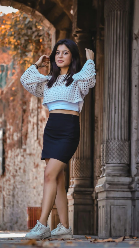 an attractive woman wearing blue posing for the camera