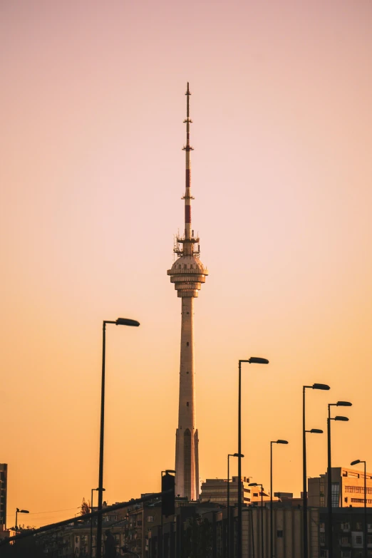 a tall tower with several lamps on it