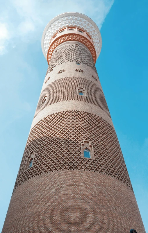 a tall brick building with a circular tower top