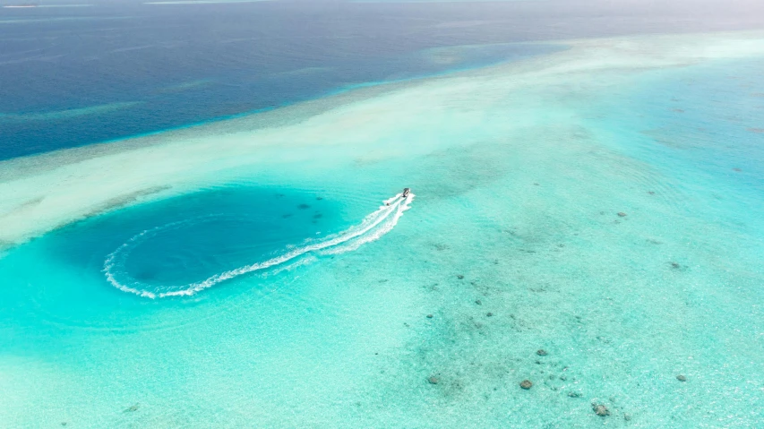 a small boat traveling down an ocean surface