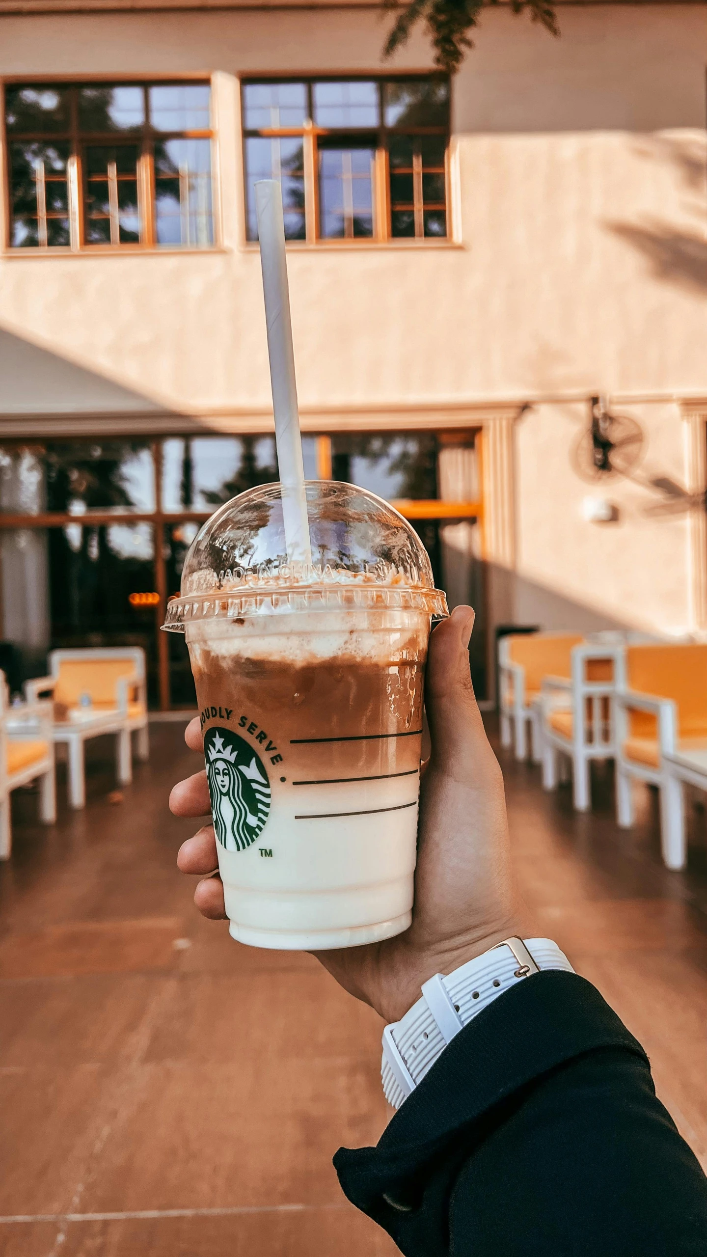 a starbucks coffee sitting on top of a wooden table